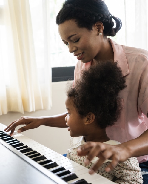 Girl learning piano