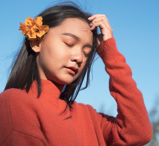 Young woman wearing flower